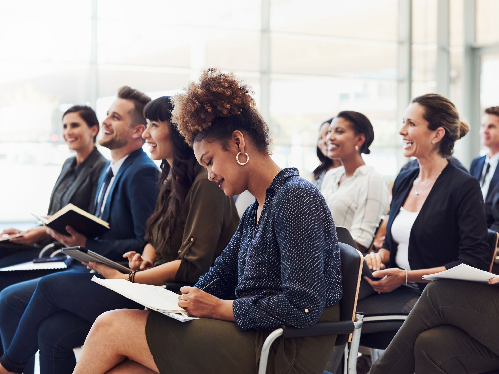 Staff taking notes during meeting