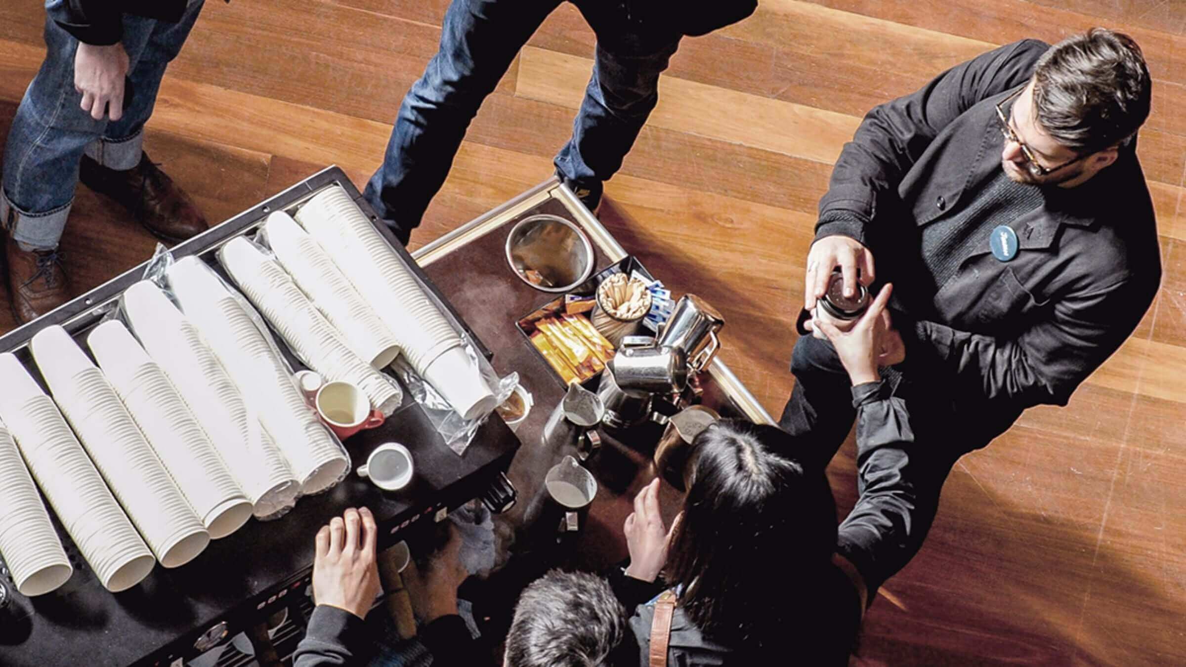 Baristas serving coffee