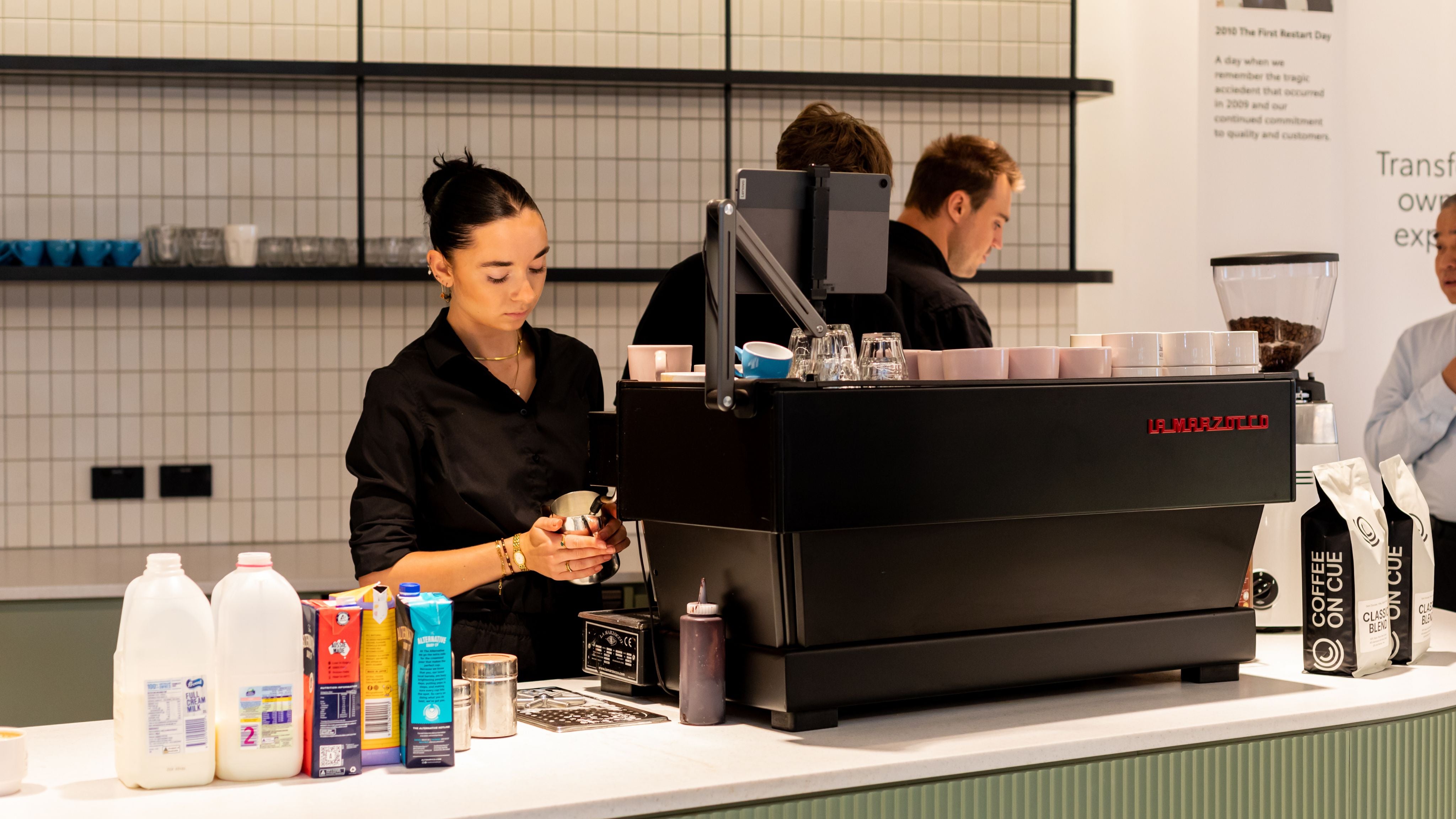 Barista making coffee in the office