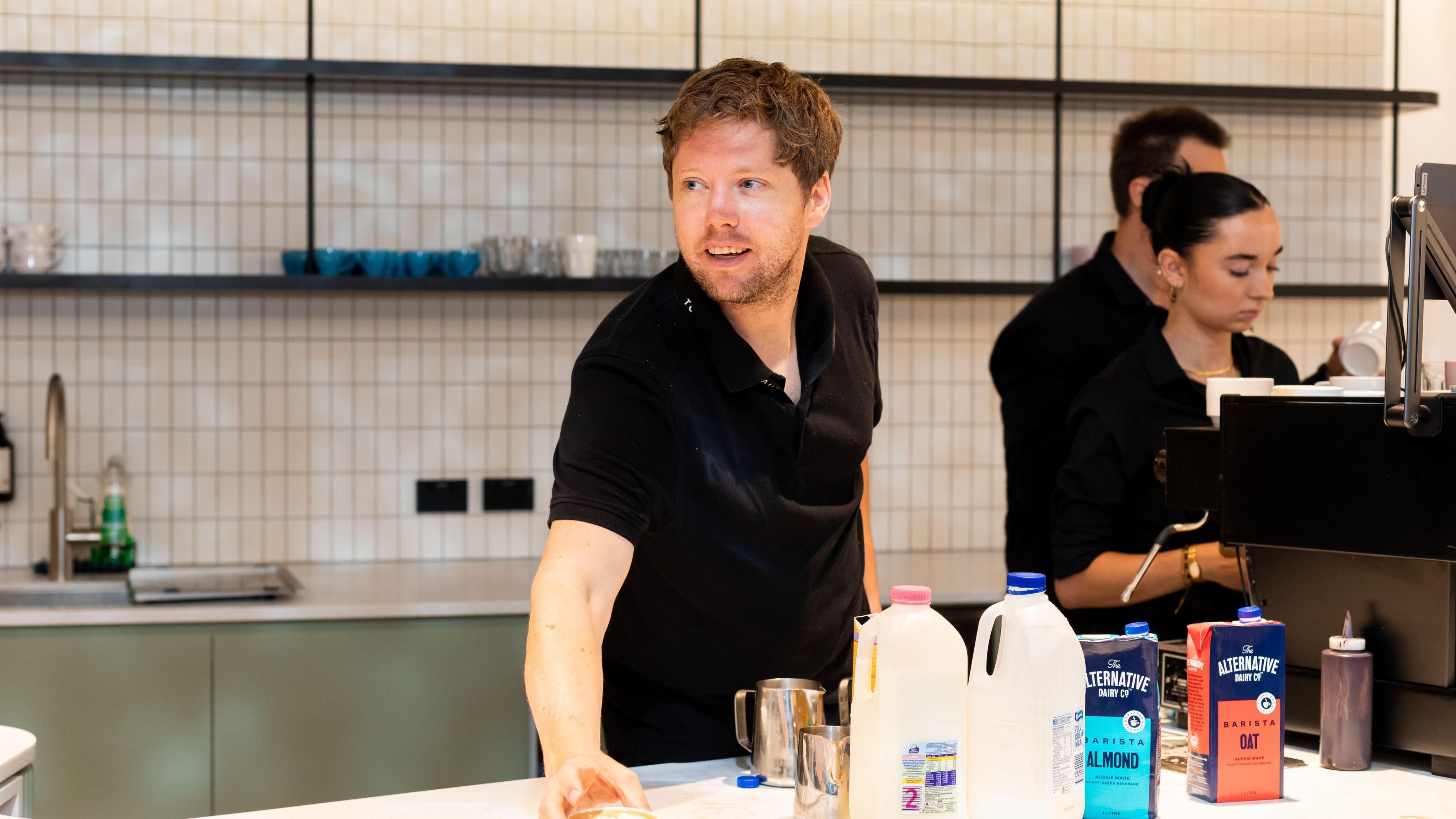 Barista serving coffee in the workplace