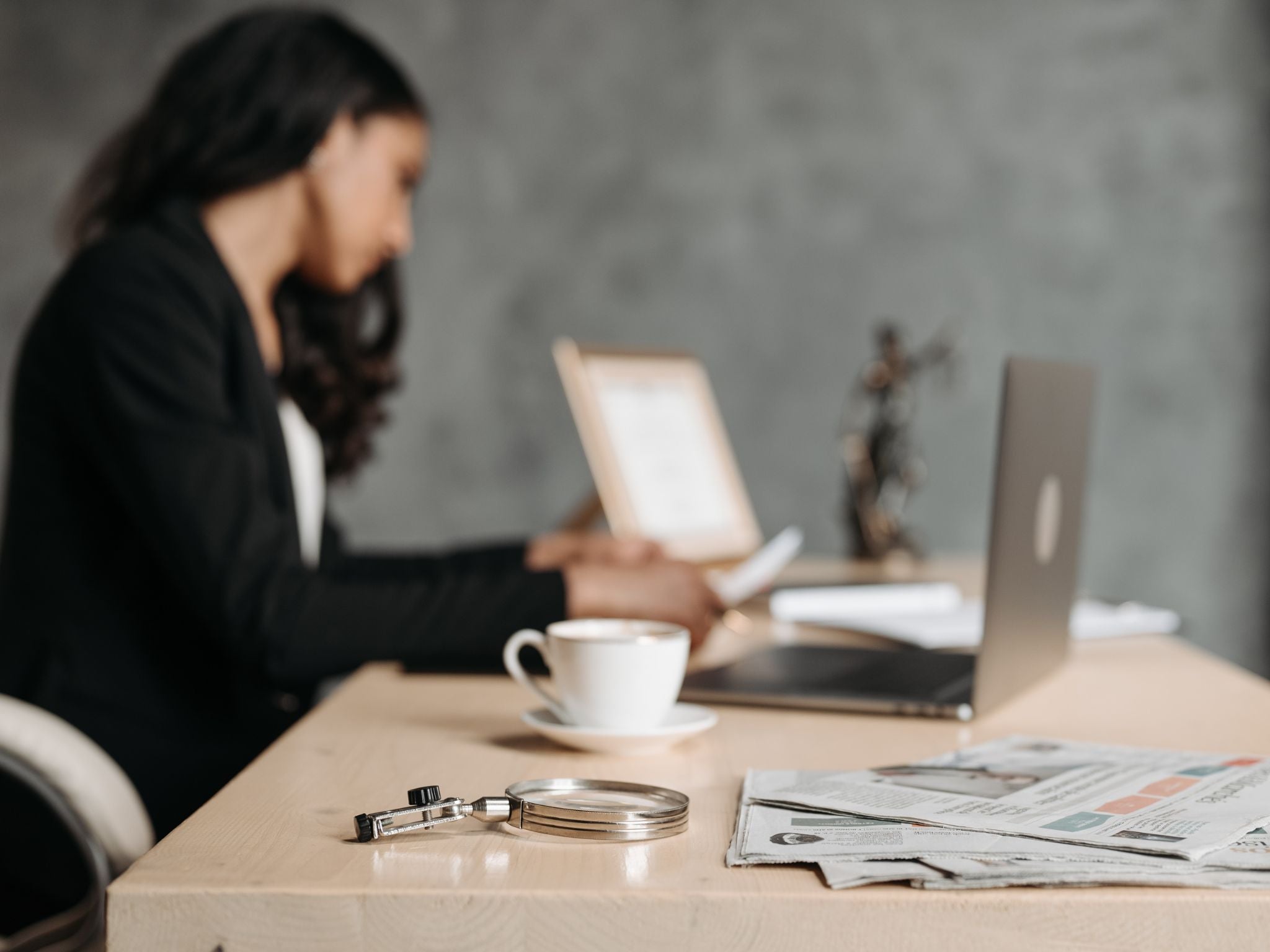 Working at desk in office with coffee