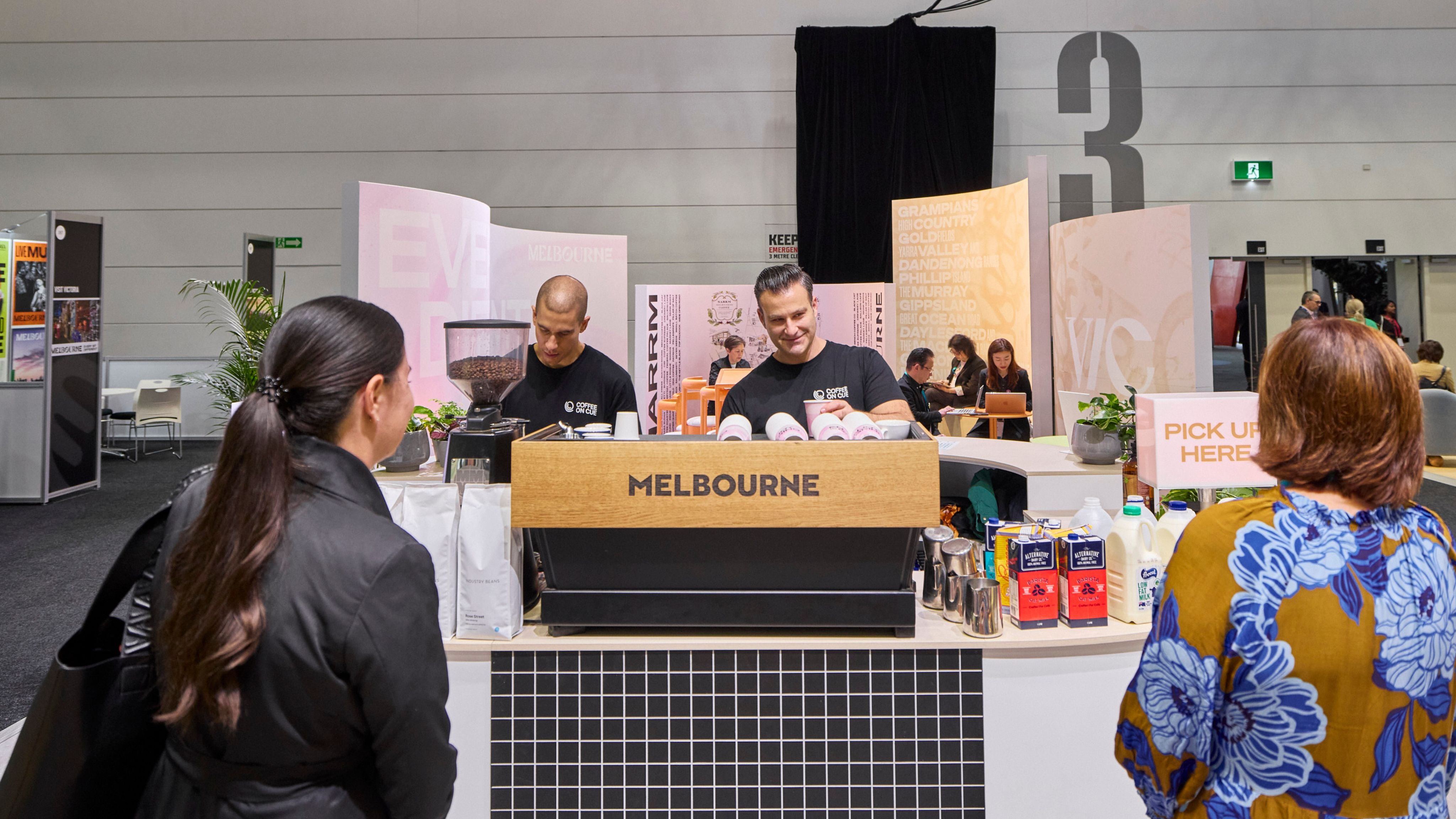 Coffee machine and baristas on tradestand