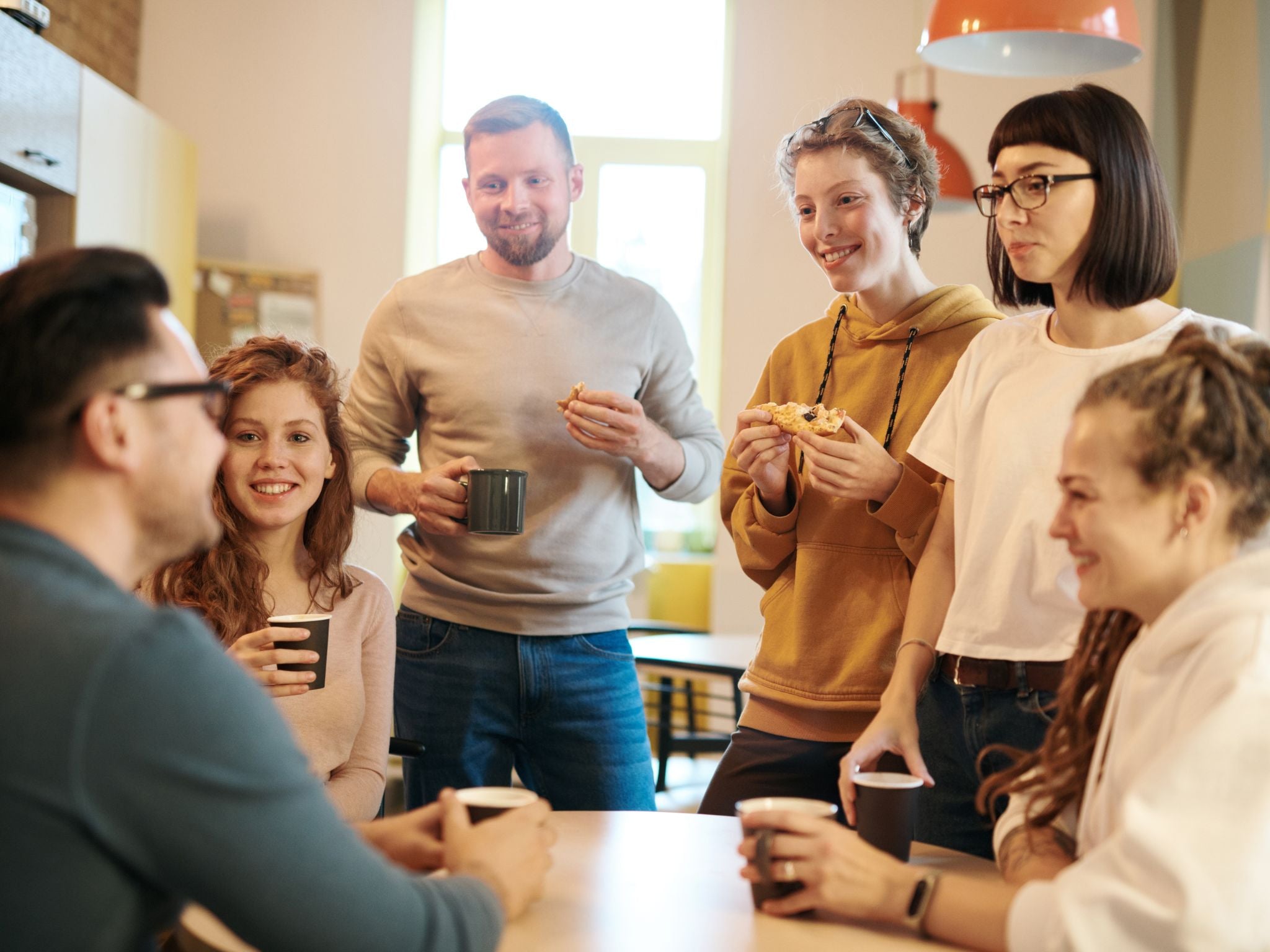 Team drinking coffee together