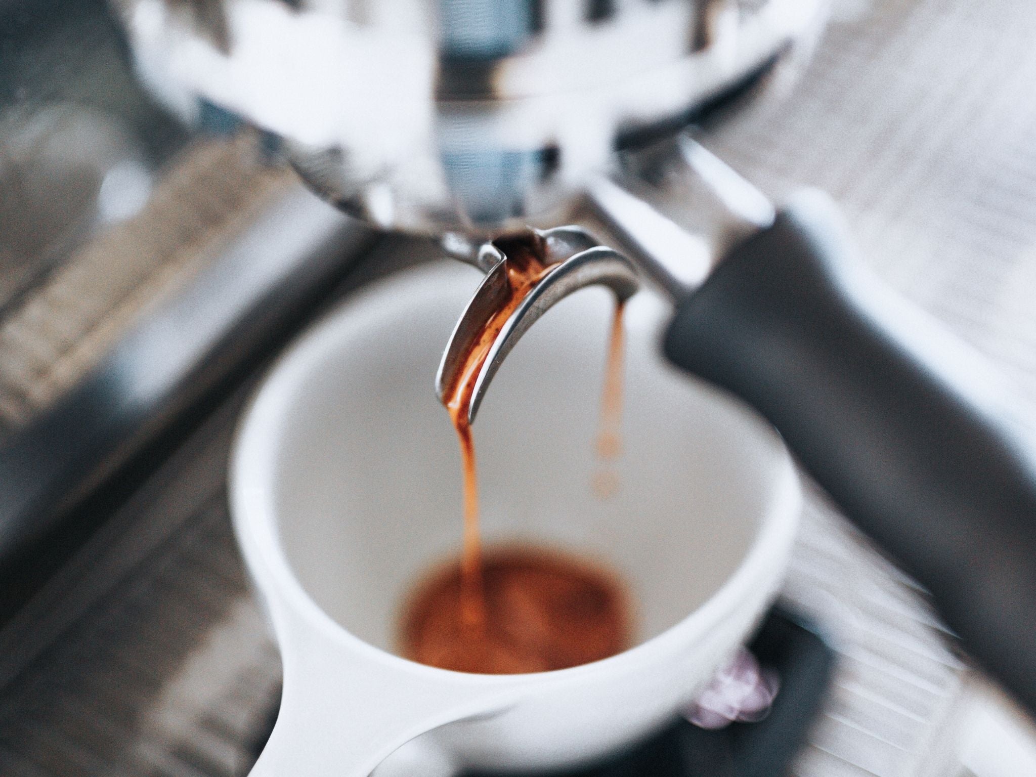 Espresso shot pouring into cup