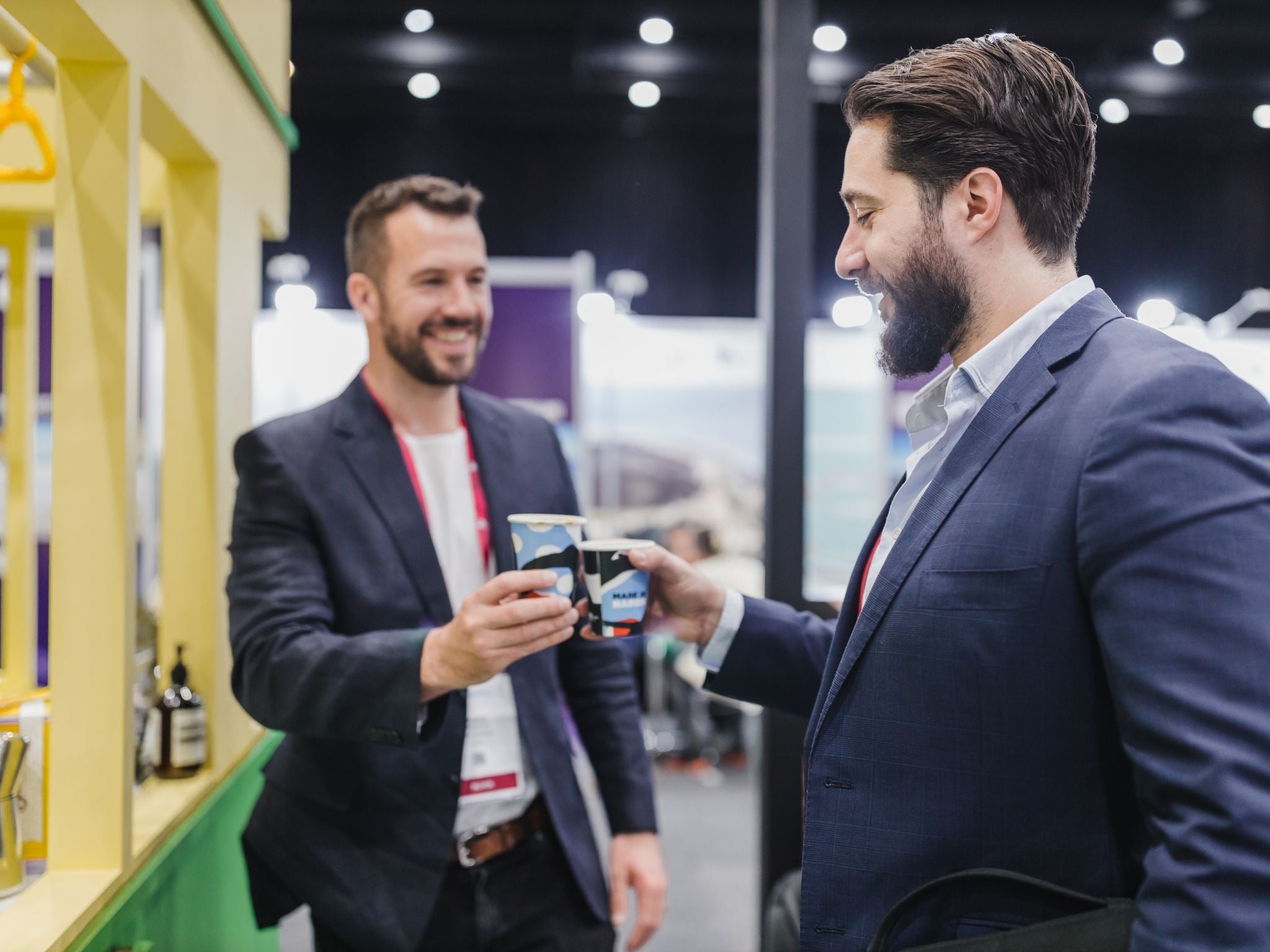 Event guests cheering their coffees