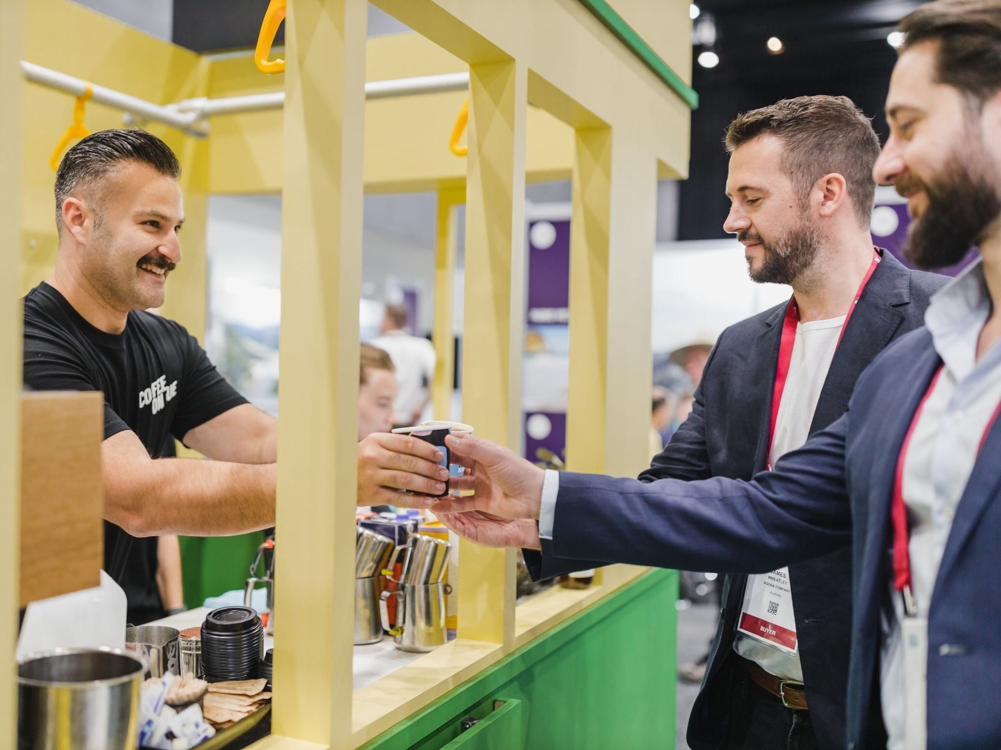 Trade show attendees collecting their coffee