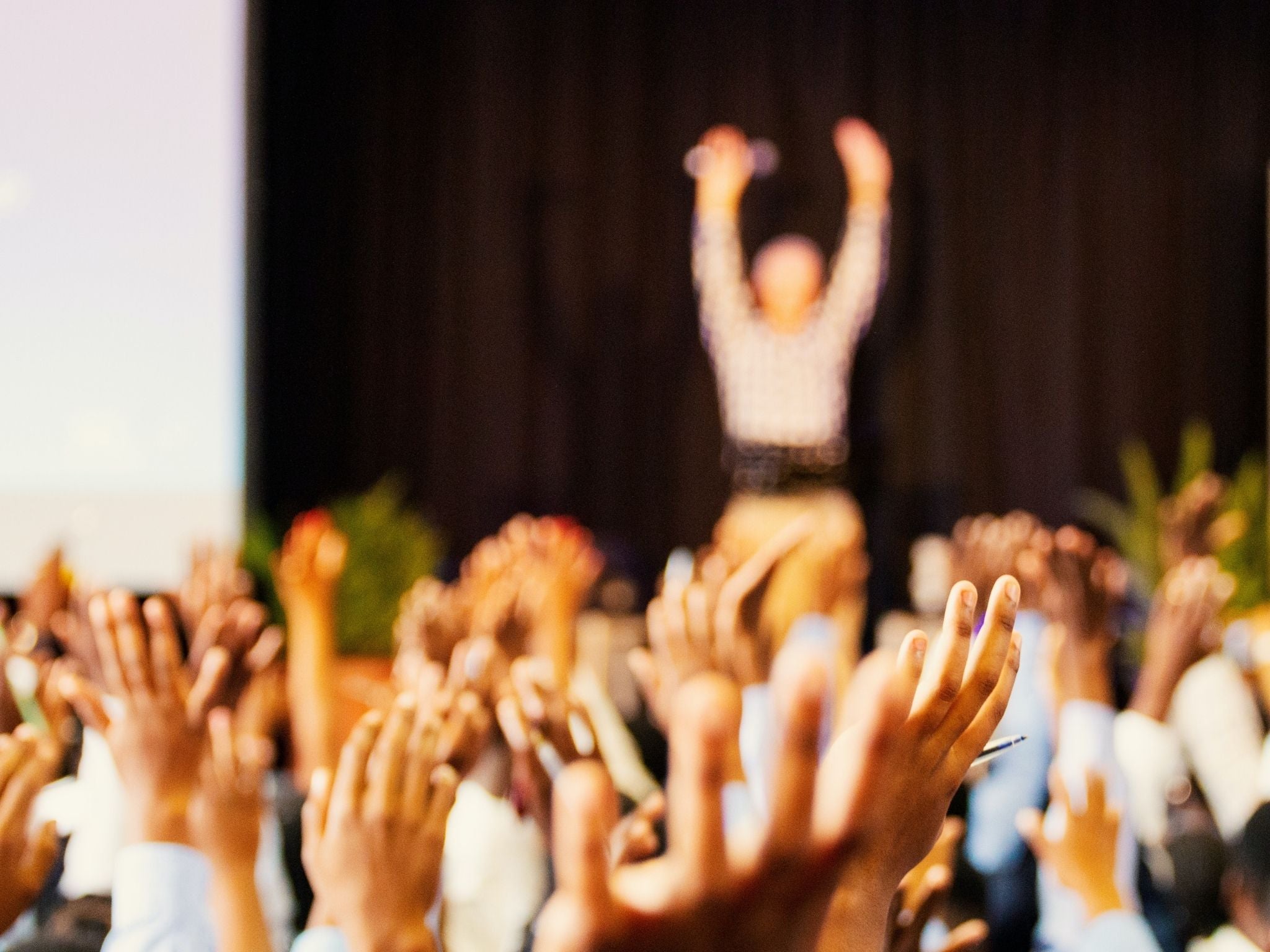 Raised hands at event