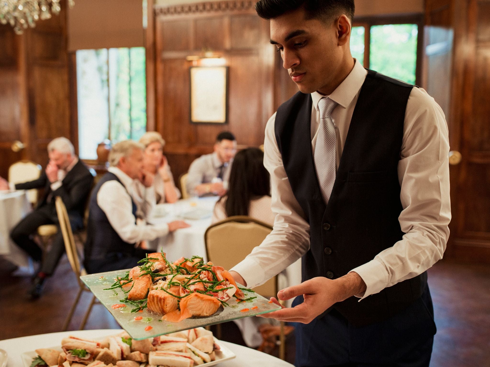 Table service provided by catering staff at event