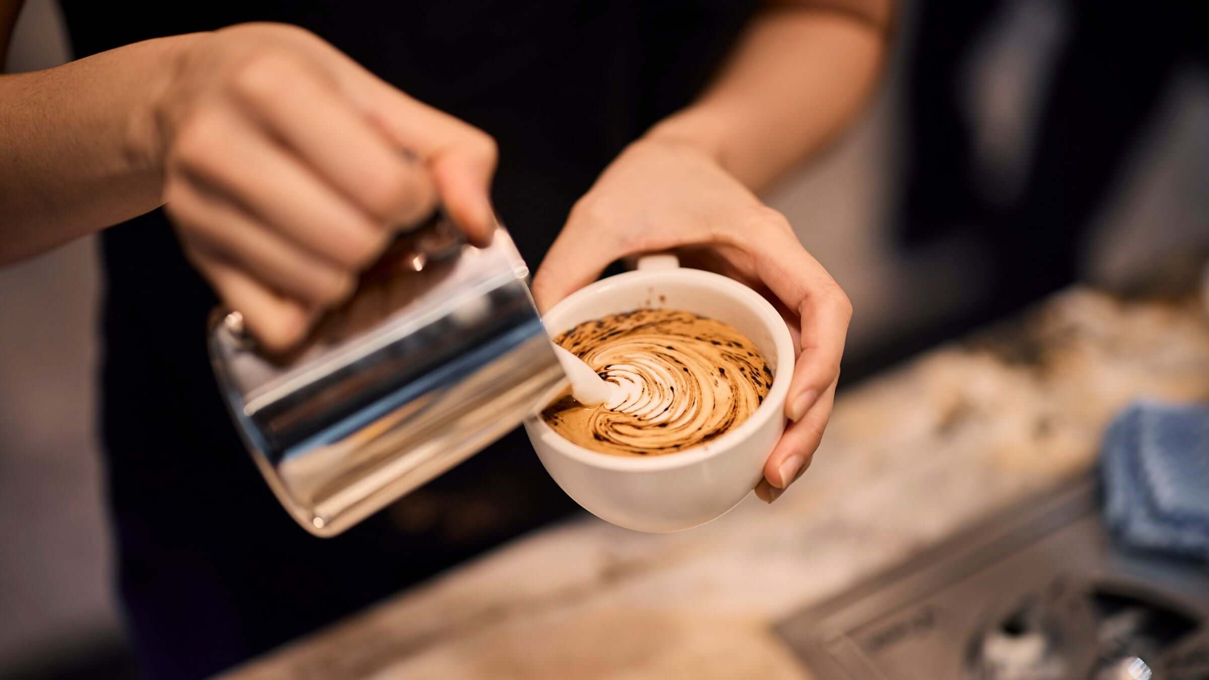 Coffee latte art poured by JLL in-house barista