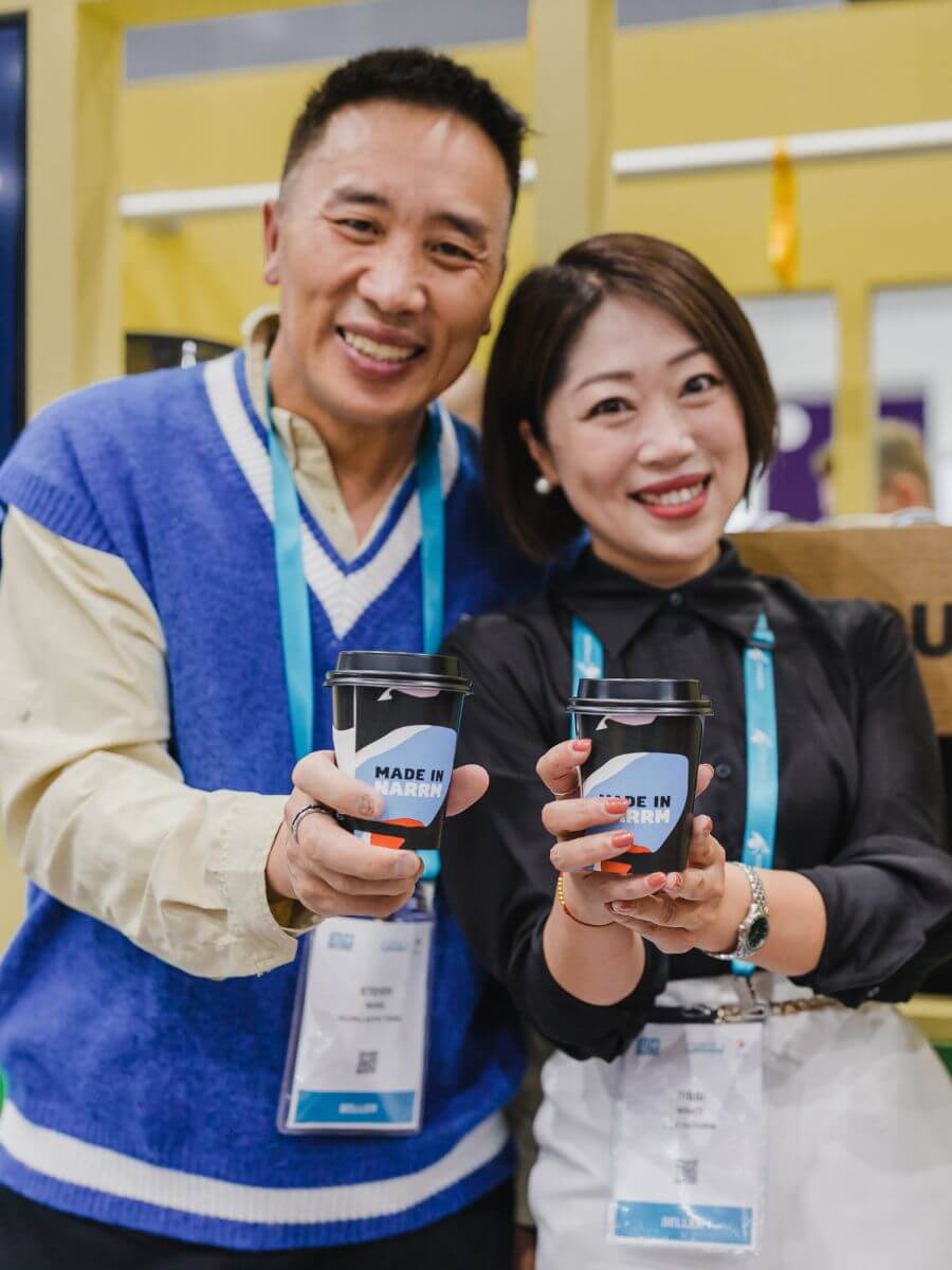 Delegates with their coffees at trade show