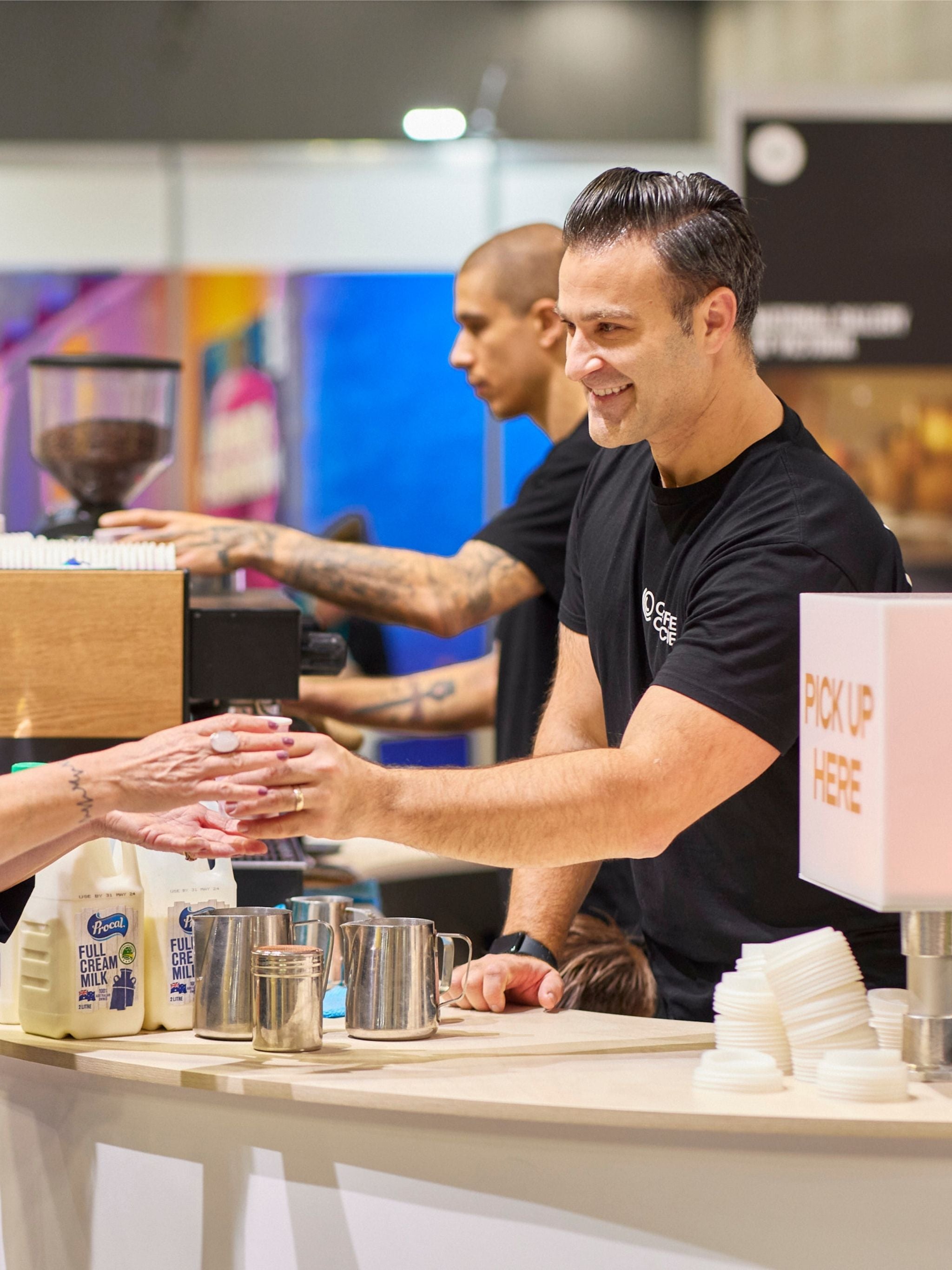 Barista serving coffee to event guest