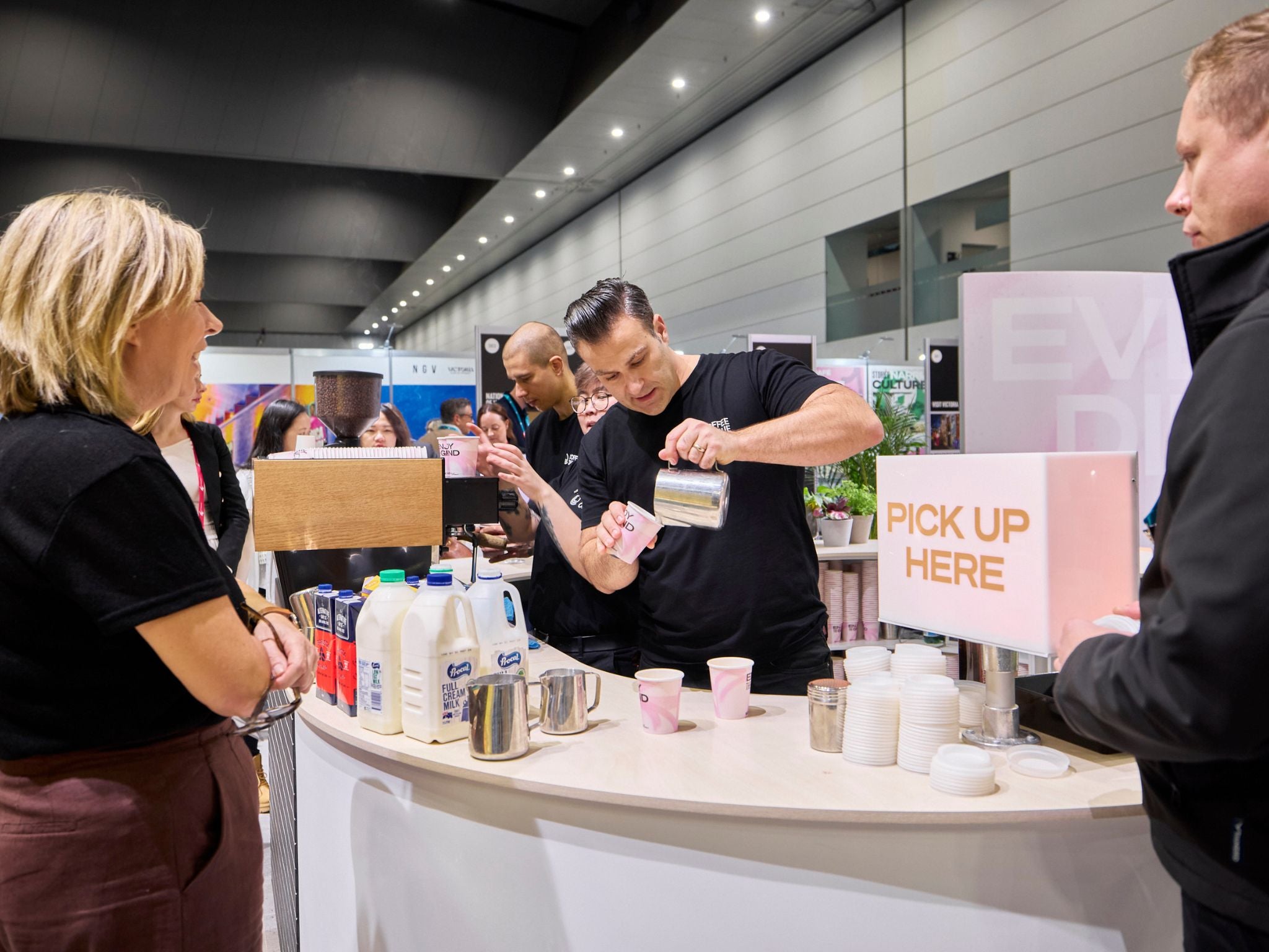 Barista serving ate show guests