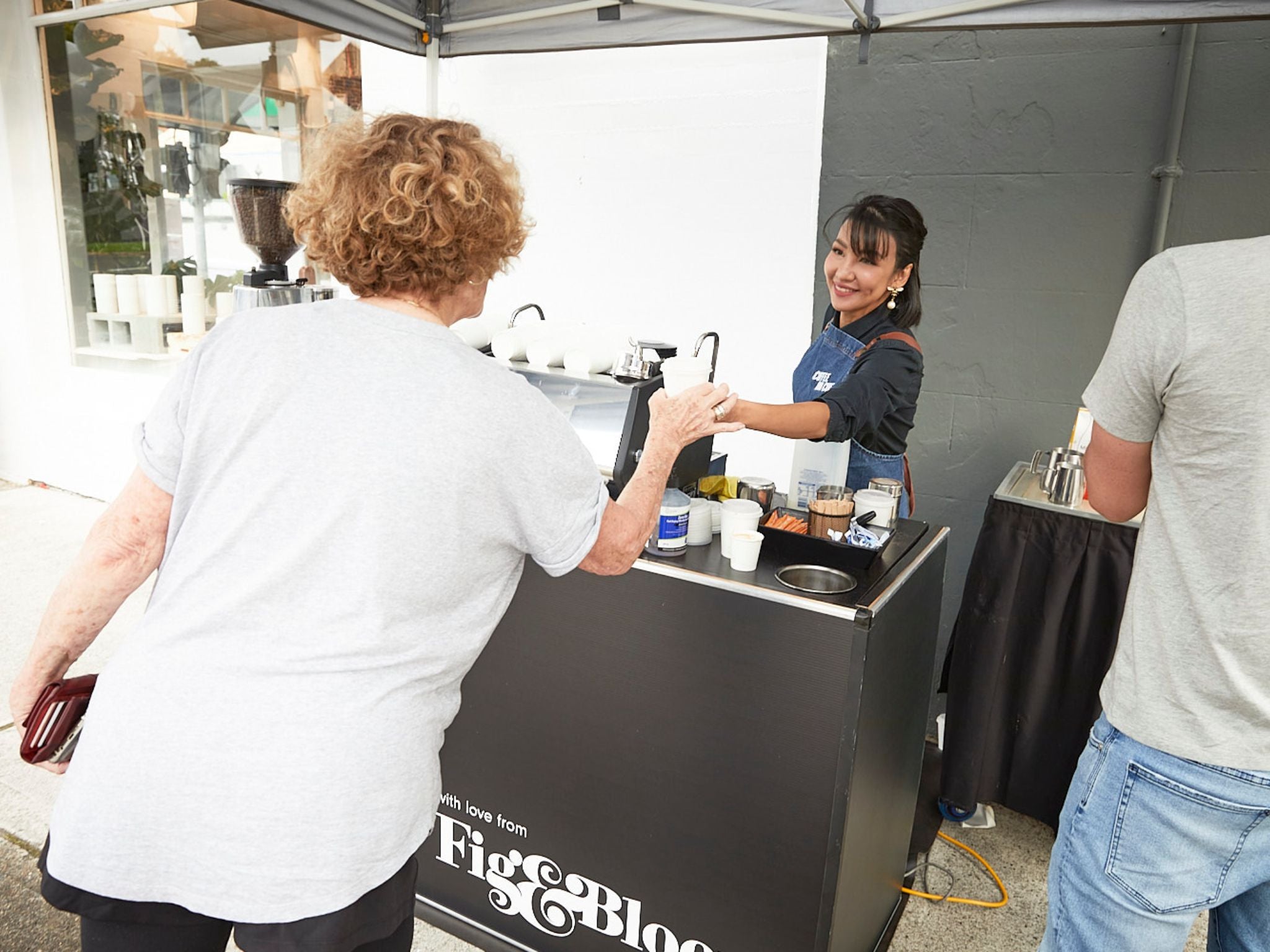 Barista serving coffee at brand activation event