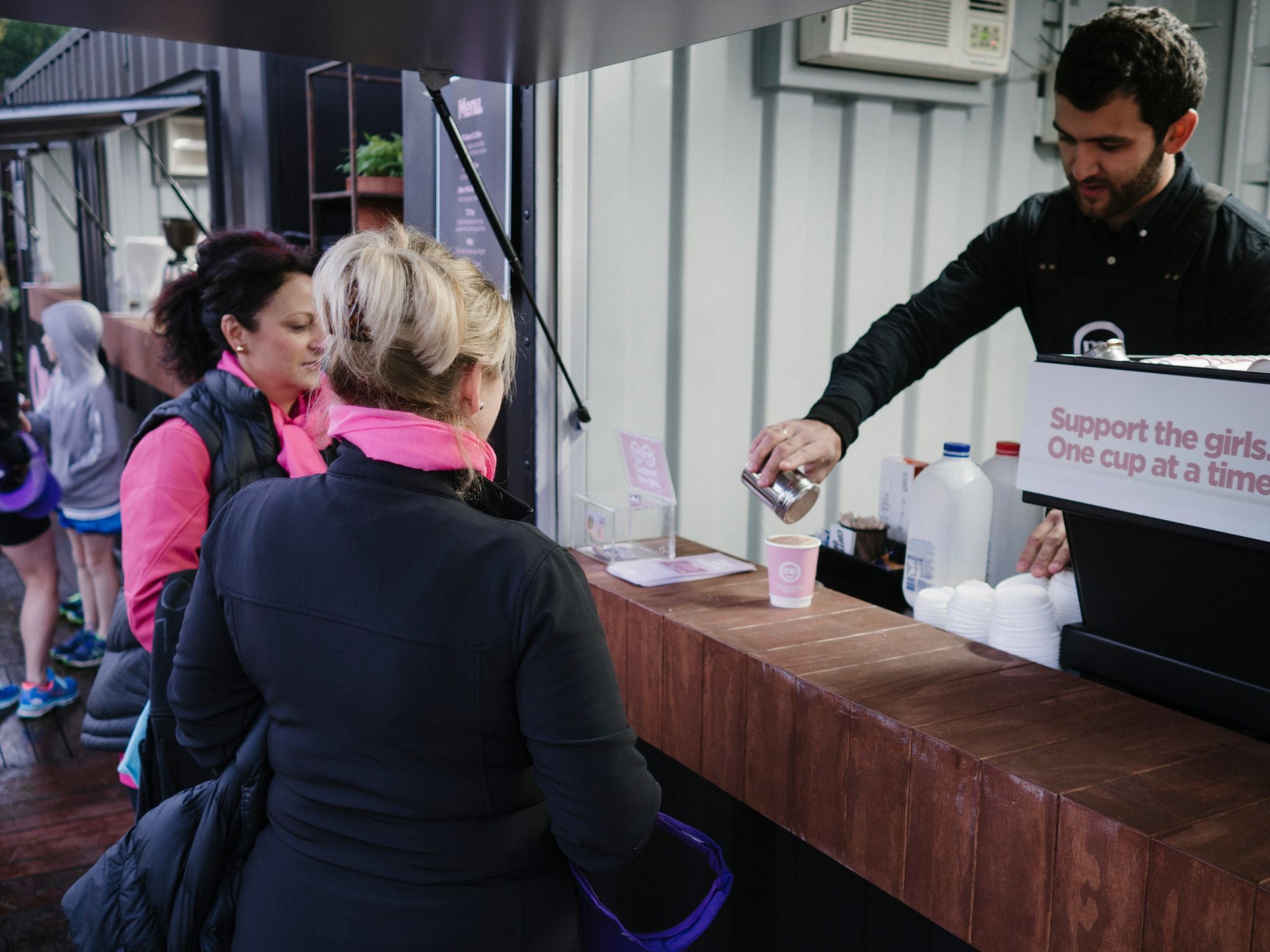 Event barista serving attendees