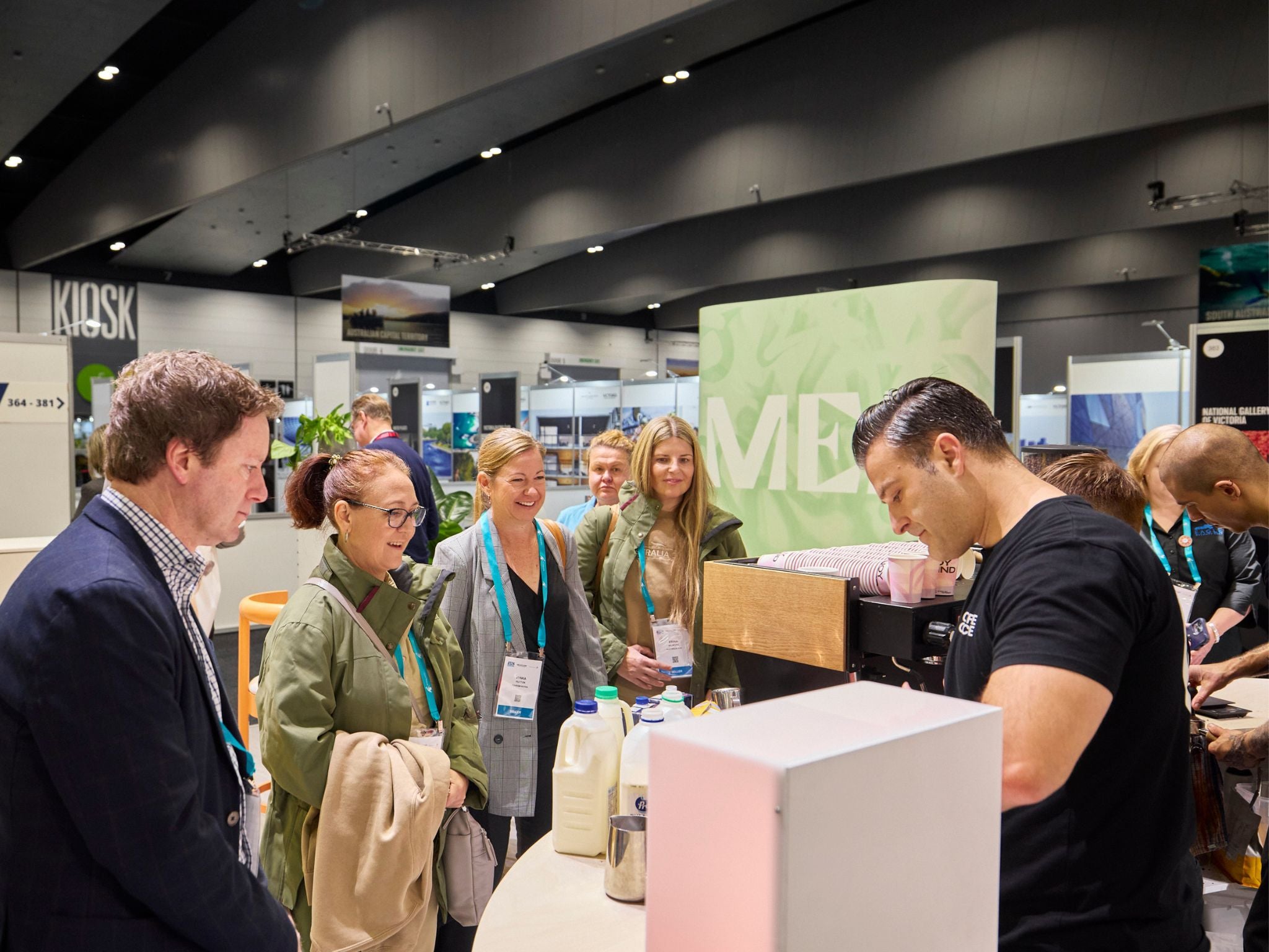 Trade show guests ordering coffee