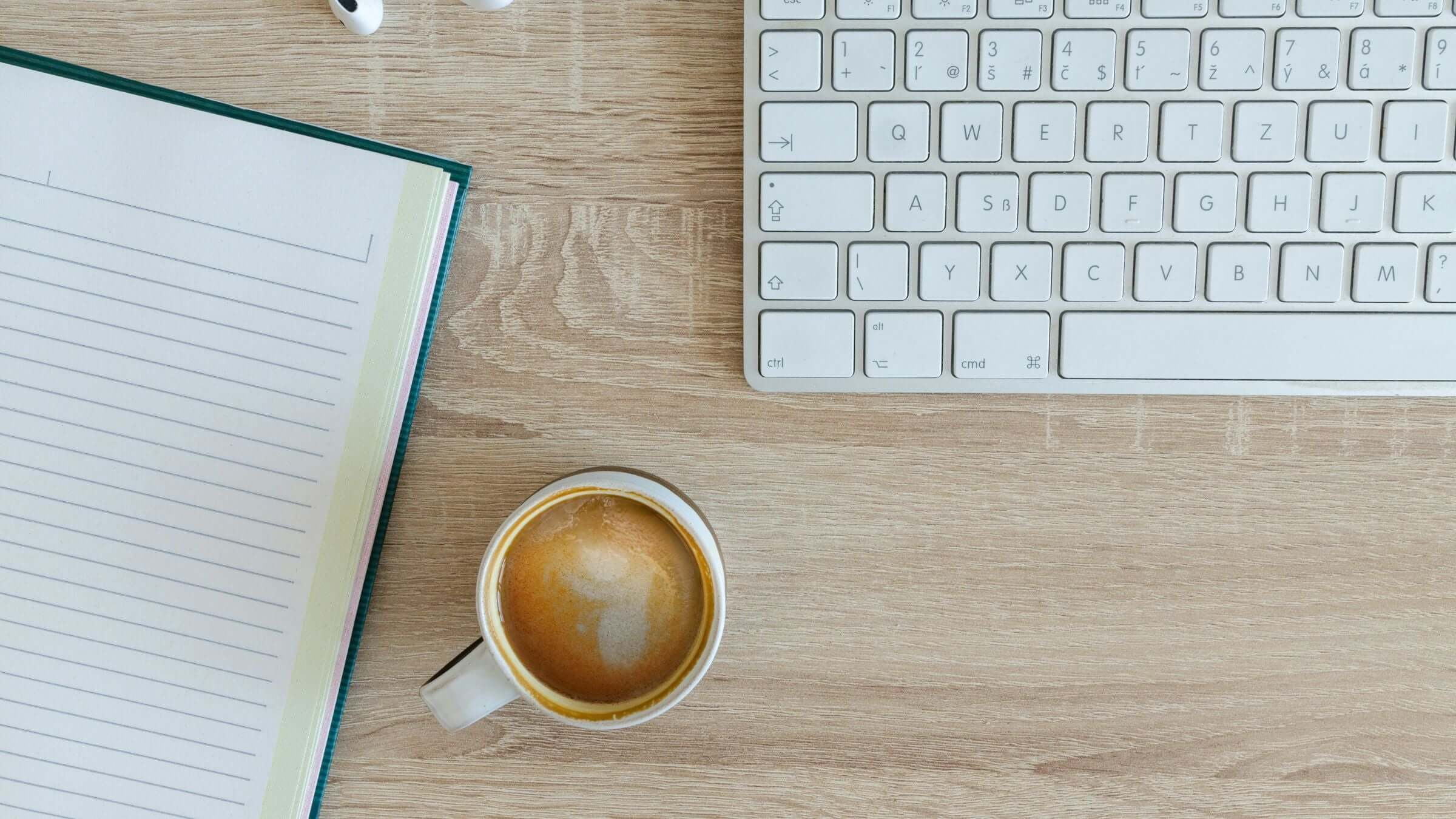 Office coffee with keyboard and notepad