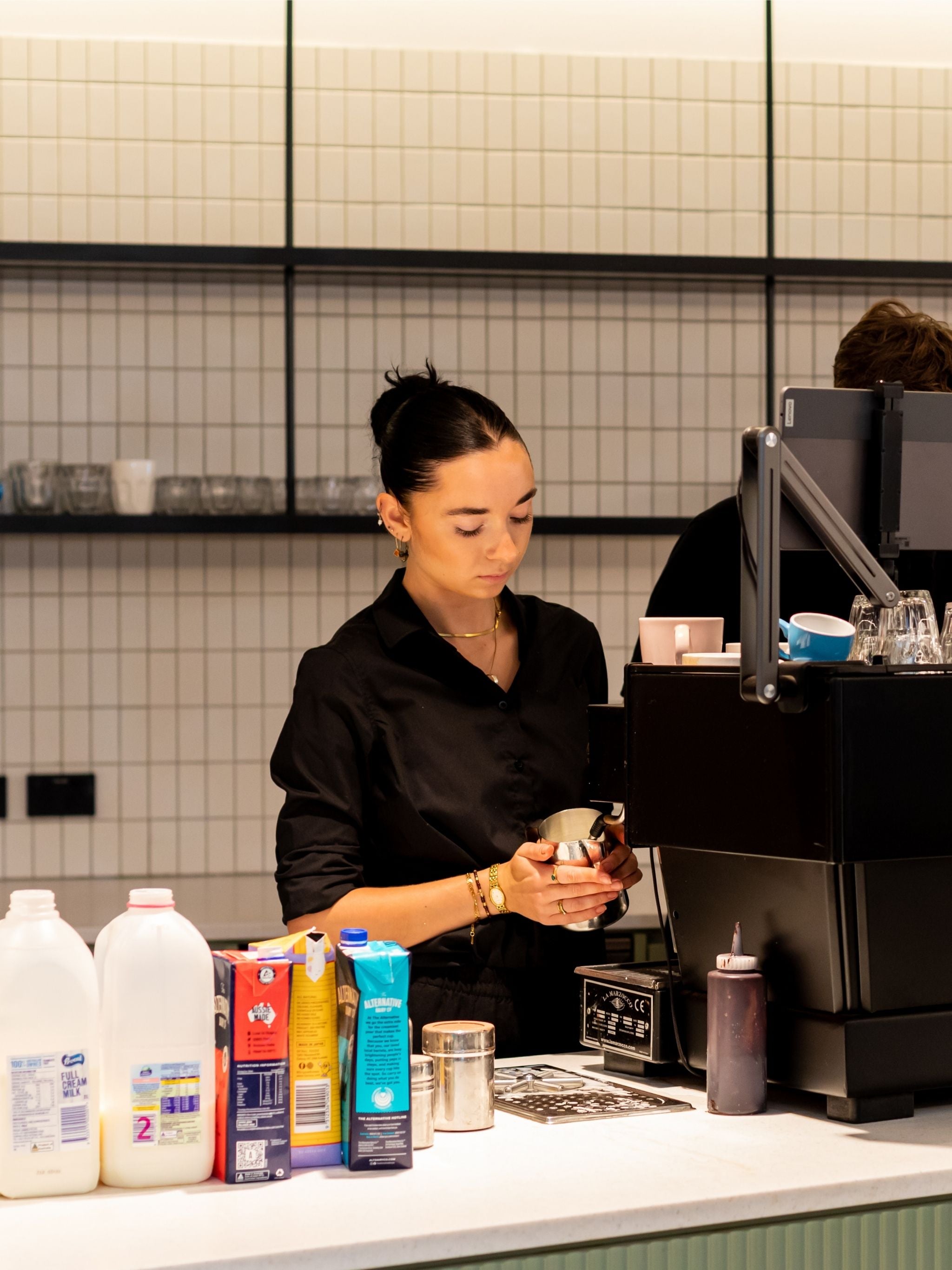 Workplace barista making coffee in the office