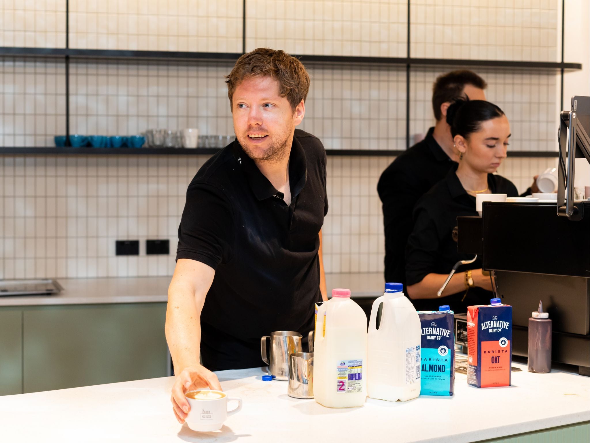 Workplace barista serving coffee