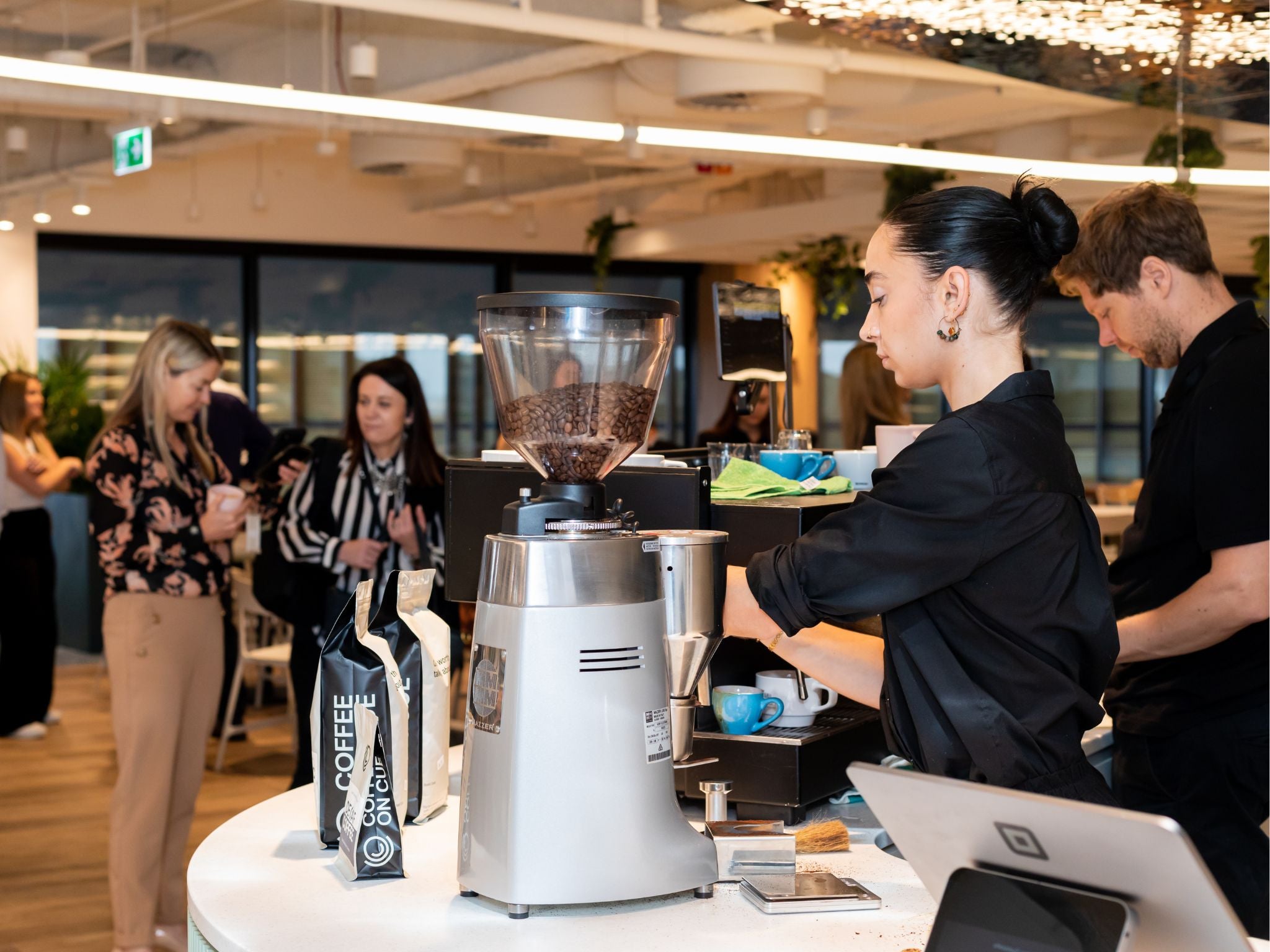 Workplace barista making coffee