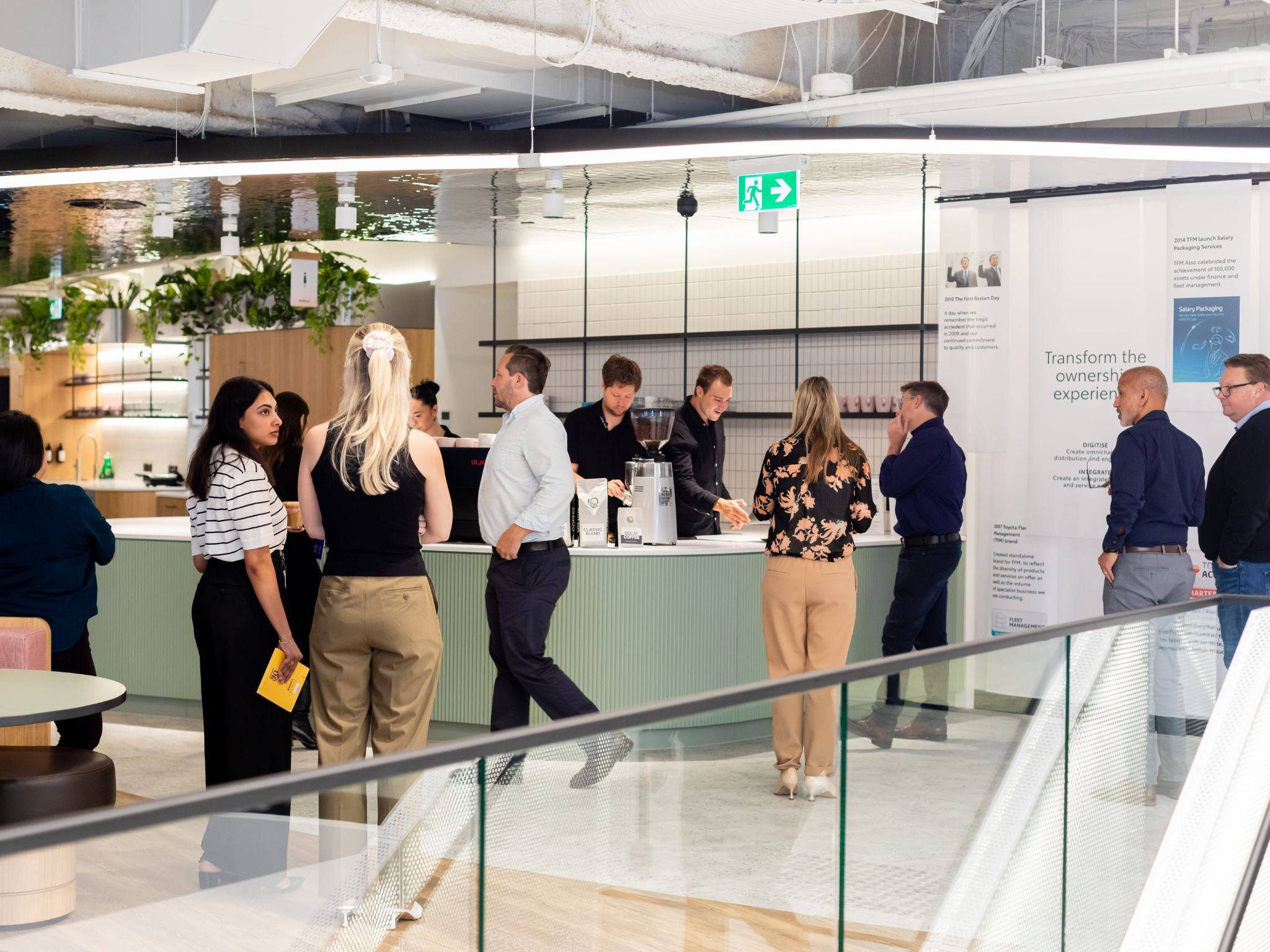 Staff buzzing around workplace cafe