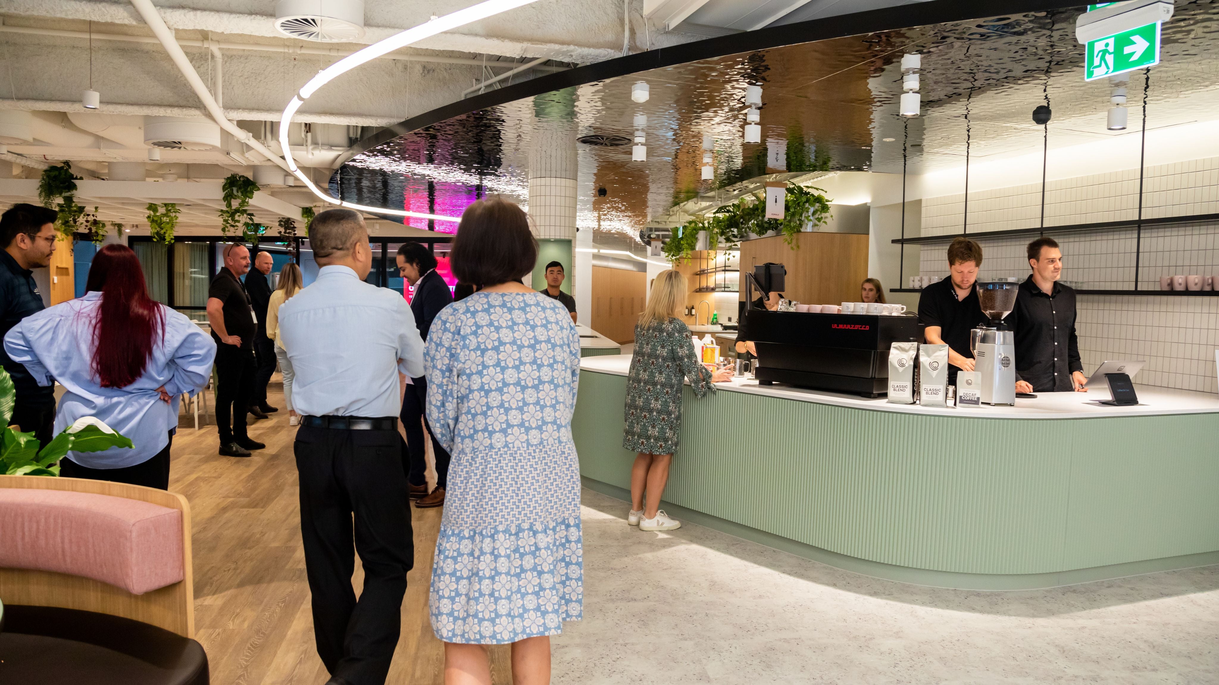 Customers waiting to get their coffee from in-house cafe